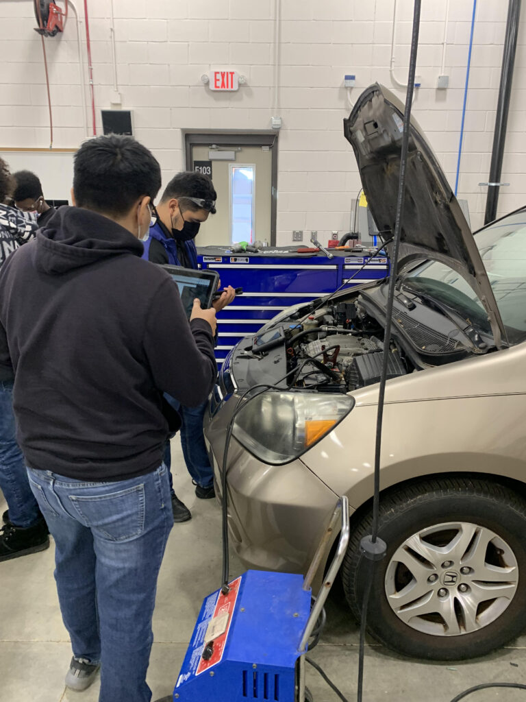 Donations from local business afford students opportunity to work on electric vehicles and a racing car